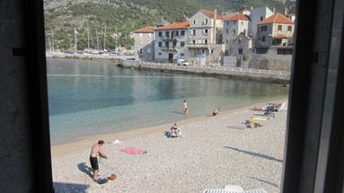 Vis, Komiža, traditional stone house on the beach